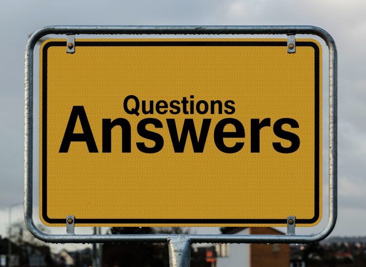 words questions and answers written on a yellow board