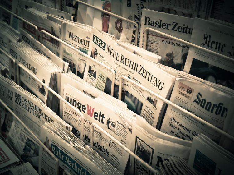 newsstand with different newspapers
