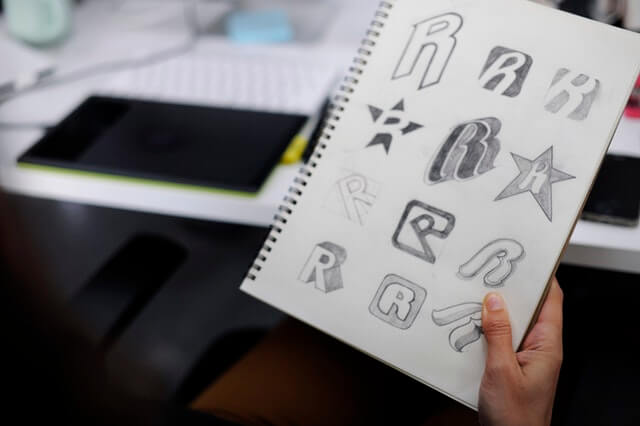 a sketchbook with different styles of writing in it
