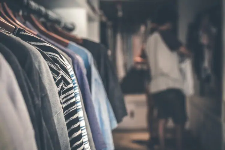 a rack with clothes in a store