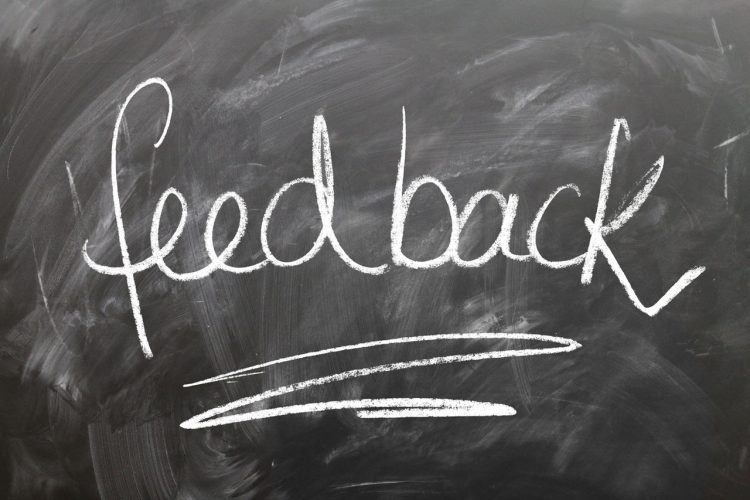 word feedback written with chalk on a blackboard