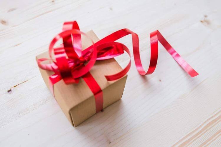 a present wrapped with red ribbon