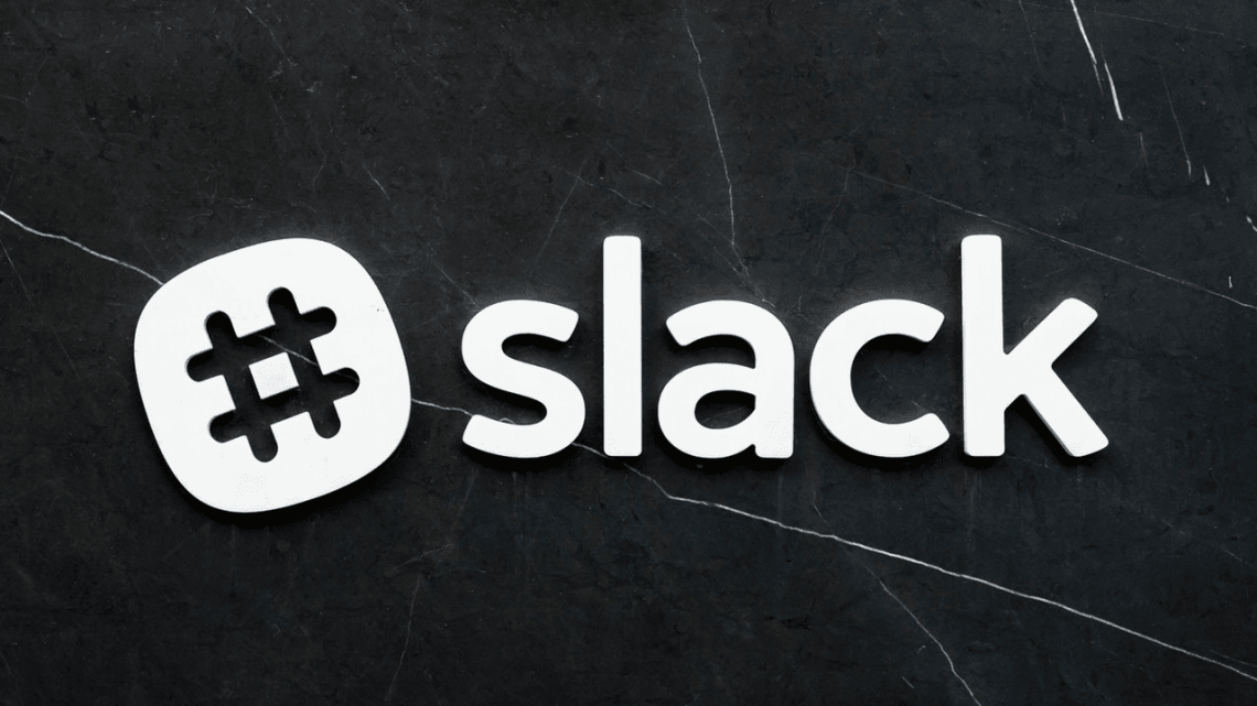 white slack logo on dark background