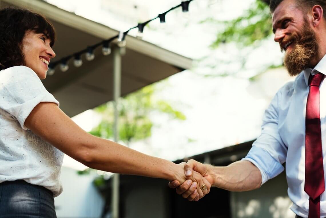 a man and a woman shaking hands