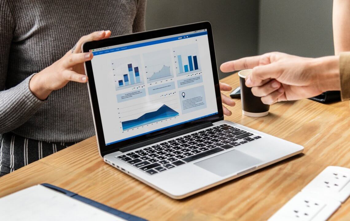 a view of a laptop with different graphs on the screen