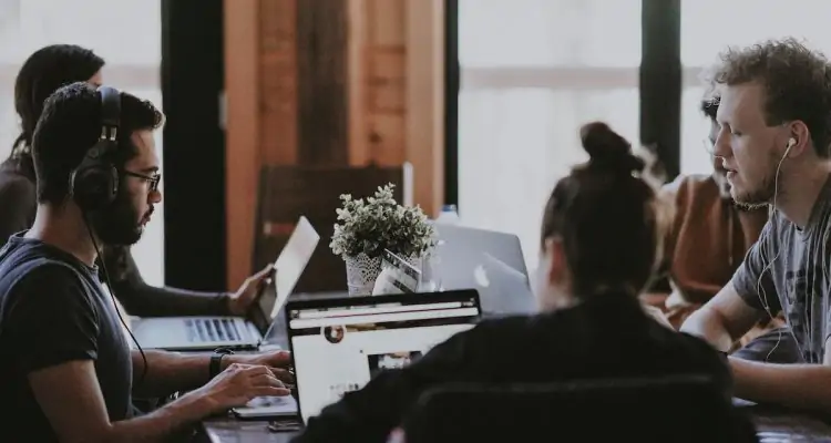 Employees sitting at a table.